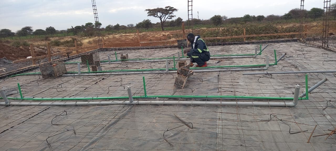 Fitting conduit and pipework into a rebar slab mesh